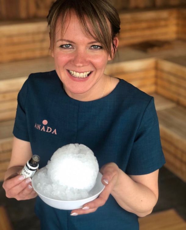 Anada practitioner holding a snowball and essential oil